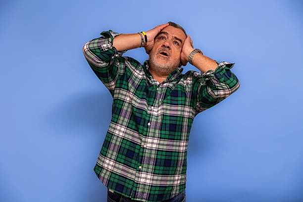 istock Mature adult man experiencing stress and headache 2247511483