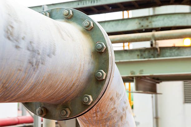 istock Industrial pipeline conveys materials connected with bolts for industry concept. 2247515393