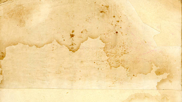 istock Cream-colored surface of old paper with streaks and stains. 2247515455