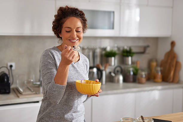 istock Woman enjoying healthy breakfast in modern kitchen 2247515621