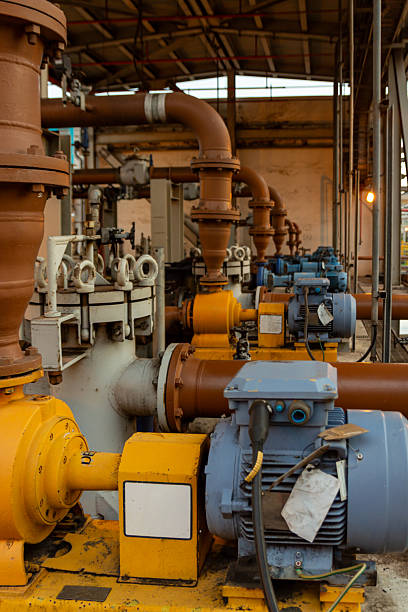 Industrial pumps and pipes, showcasing a mechanical system design with a colorful engine room.