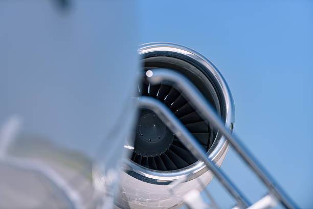 istock Business jet engine with stair railing in foreground 2247524452