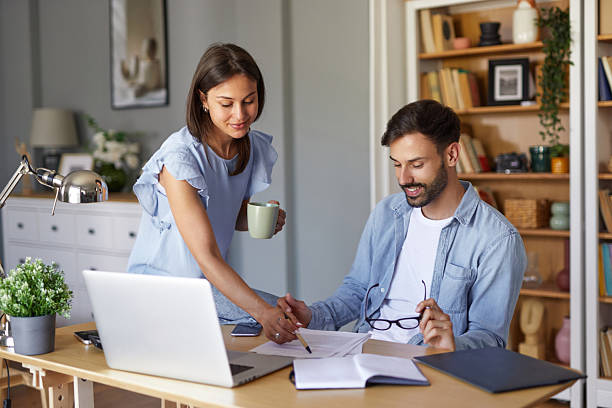 istock Young couple working from home having a conversation about their business 2247525288