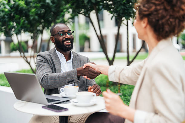 istock Successful business agreement sealed with a handshake in cafe 2247527835