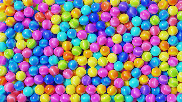 istock Colorful glass marbles background, 8K. 2247531515