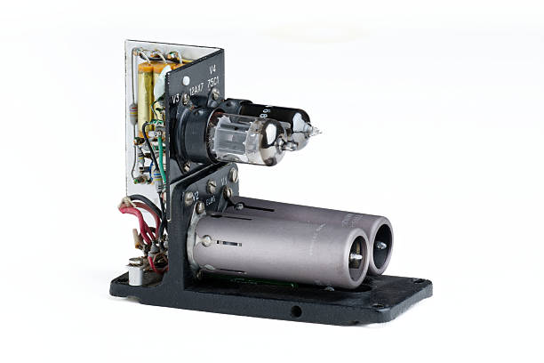 istock Vintage radio frequency power amplifier electronic module featuring vacuum tubes and circuit board detail on a clean white background. 2247531551