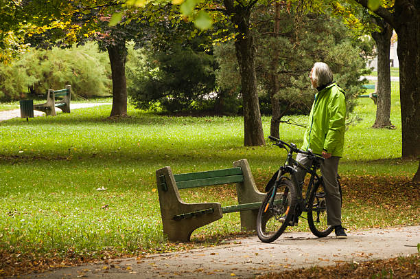 legnano, Italy - August 18, 2016: Rear view of a man sitting on bench park