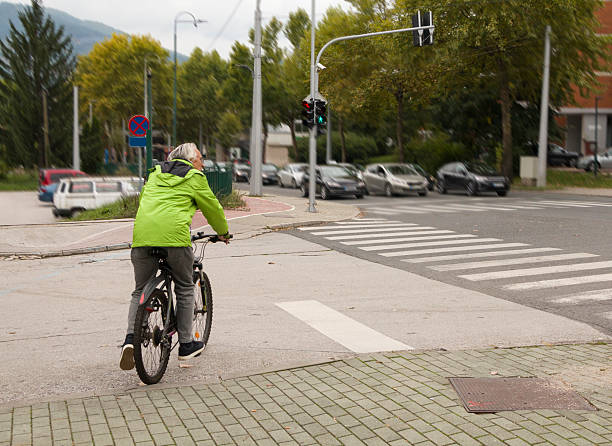 istock Happy active senior man cycling in the city 2247534743