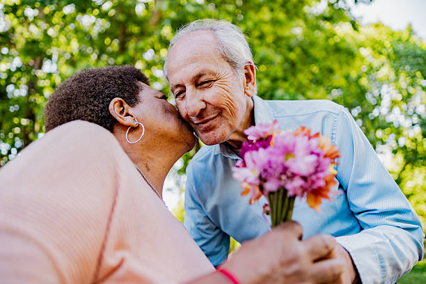 istock Loving moment between senior couple in park 2247536536