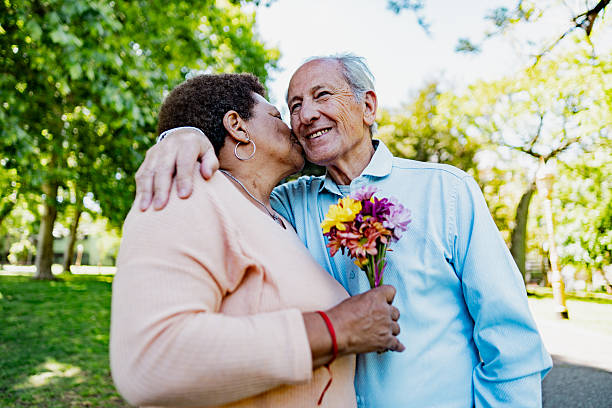 istock Loving moment between senior couple in park 2247537026