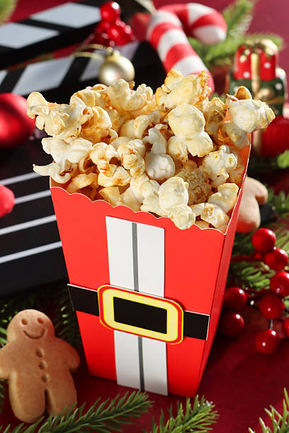 Popcorn in a wooden bowl close-up, background. Top view