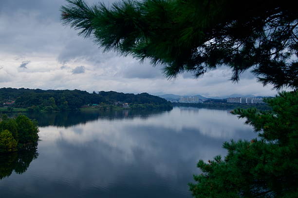 The South Han River widens below Tangeumdae Park, with apartment towers and wooded hills lining the far bank.
