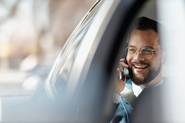 istock Businessman Talking on Phone Inside Car 2247542660
