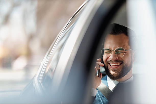 istock Businessman Talking on Phone Inside Car 2247542661