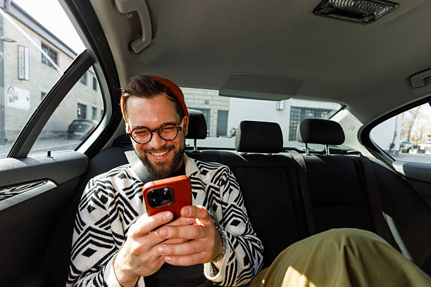 istock Man Having Video Call in Car Backseat 2247542676