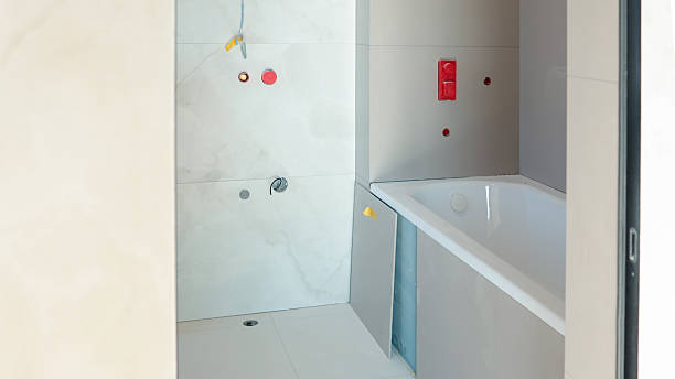 istock Bathroom renovation in progress with a new bathtub and tiled walls 2247549326