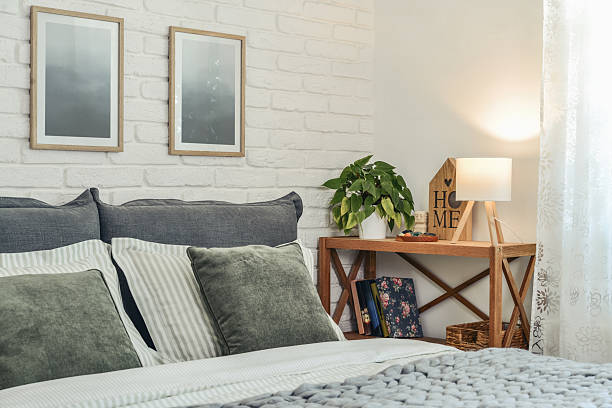 istock Stylish interior of bedroom with big comfortable grey bed 2247550732