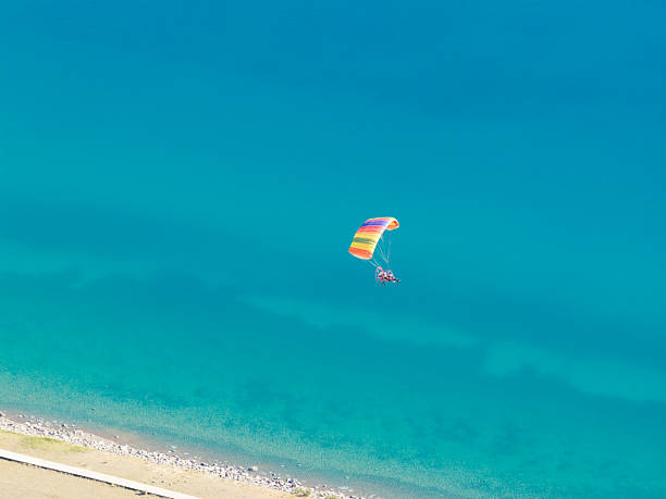 Couple up high parasailing with room for copy space