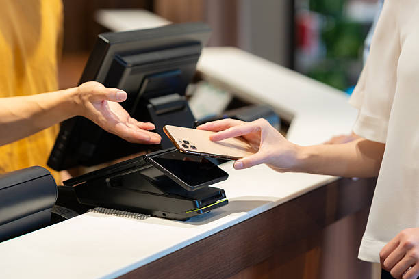 istock young people making mobile payments with their smartphones 2247554005