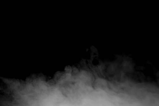 istock A dark atmospheric background featuring drifting white smoke rising against black space, perfect for mystery scenes, cinematic effects, vapor concepts, and creative design elements in modern visual. 2247560528