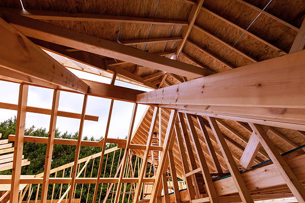 istock Construction framework roof truss wooden beams in house under renovation studs joist 2247560884