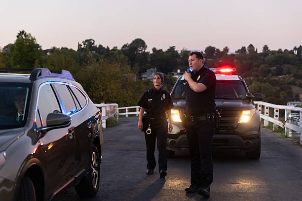 istock Two Police Officers During Traffic Stop 2247565658