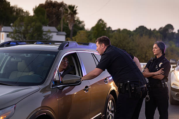 istock Police Officers Interrogate Driver During Traffic Stop 2247565668