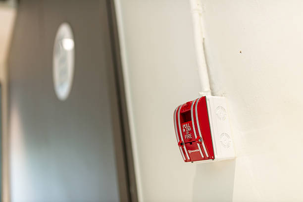 istock Red Fire Alarm on White Wall in Hallway 2247565910