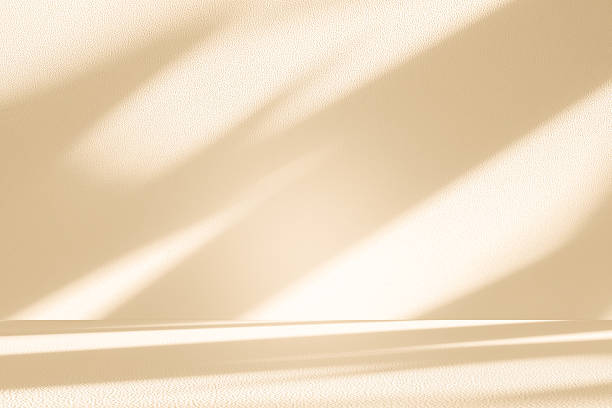 istock Studio style background wall decoration presentation uses white and beige tones. with shadows cast from a nearby window, concept creating a decorative 2247573531