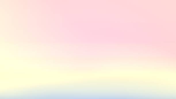Background with warm gradient transitions blending peach yellow and grey tones across the image