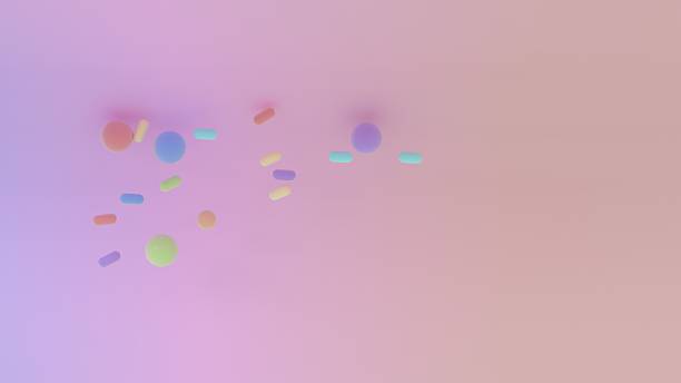 istock Soft pastel composition with scattered capsules and spheres over a wide pink gradient background 2247574755