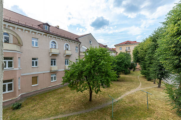 istock Courtyard View with Green Trees and Historic Buildings 2247575337