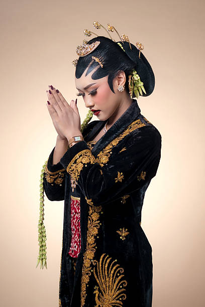 istock Graceful Javanese Bride in Traditional Prayer Pose 2247575752