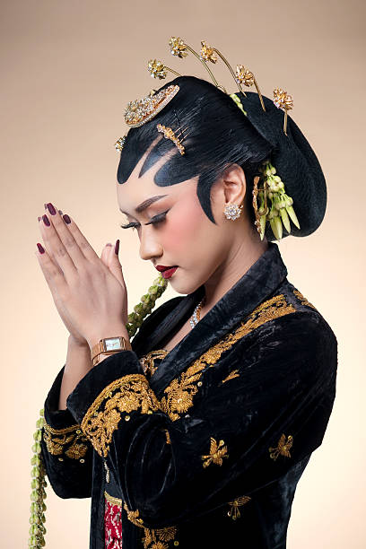 istock Elegant Javanese Bride in Traditional Prayer Pose 2247575770