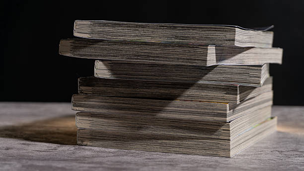 istock Uneven stack of worn paperbacks captured in side view, showing textured pages and natural aging, perfect for concepts of reading habits, study, or vintage media. 2247578146