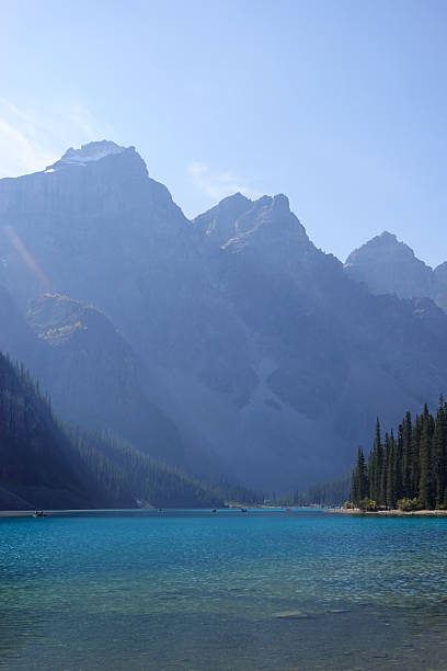istock Snow capped peaks reflected in calm turquoise alpine lake 2247578958