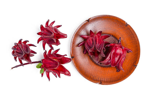 istock Top view fresh roselle fruit in wood plate on white background. 2247580294