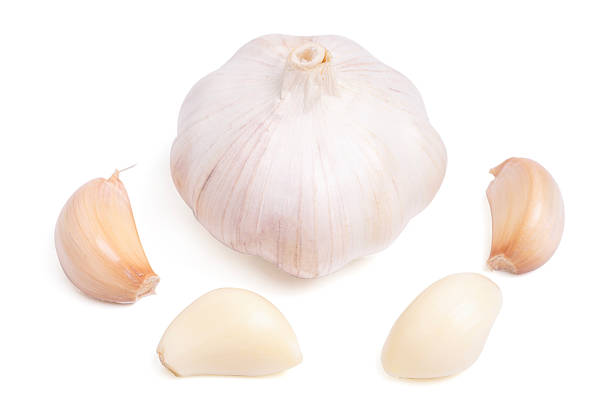 istock garlic cloves, bulb with garlic slices isolated on white background. 2247580876