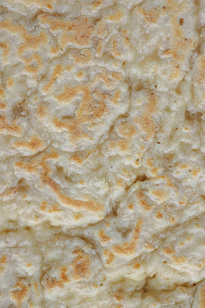 Abstract textured background surface of fresh brown bread