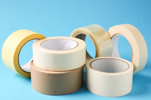 istock Rolls of different adhesive tapes on light blue background, closeup 2247588931