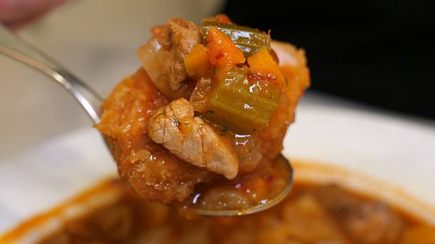 istock Creamy tomato stew with pork cutlet slices on white plate 2247591961