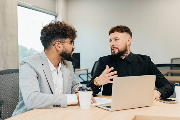 istock Diverse business partners discussing new project during meeting 2247592677