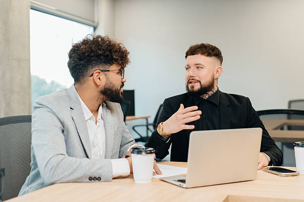 istock Business partners discussing strategy in office 2247592682