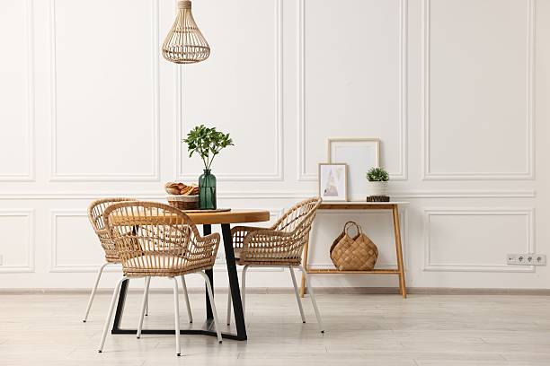 istock Dining room interior with wooden table and wicker chairs 2247595713