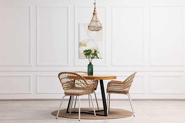 istock Dining room interior with comfortable furniture and green branches 2247595724