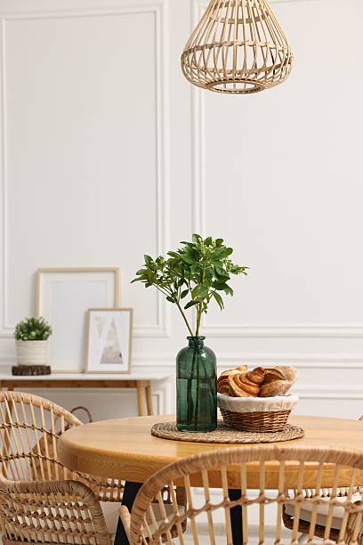 istock Dining room interior with comfortable furniture and green branches 2247595728