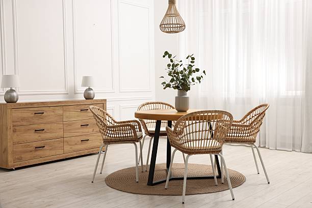 istock Dining room interior with comfortable furniture and eucalyptus branches 2247595737