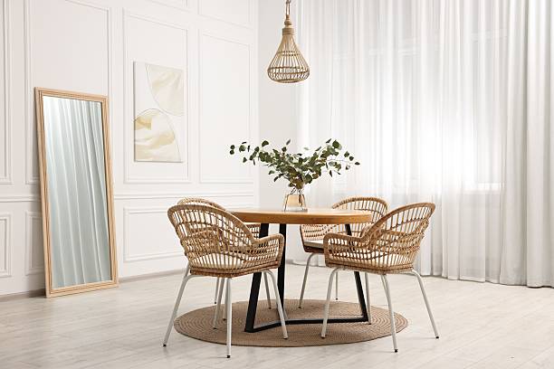 istock Dining room interior with comfortable furniture and eucalyptus branches 2247595748