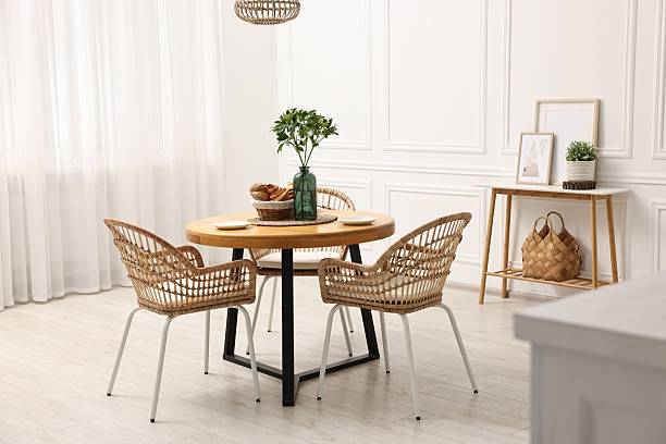 istock Dining room interior with comfortable furniture and green branches 2247595750