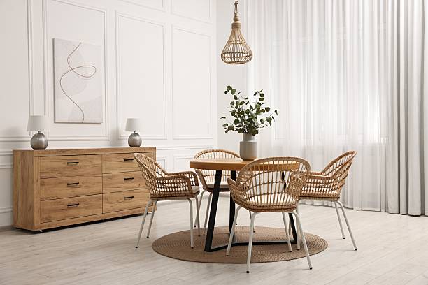 istock Dining room interior with comfortable furniture and eucalyptus branches 2247595757